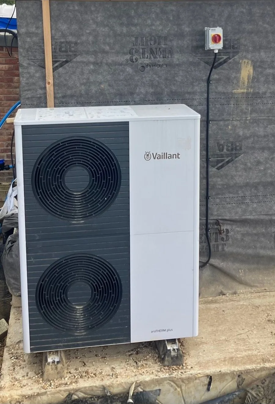 Vaillant aroTHERM plus air source heat pump outdoor unit mounted on a concrete plinth