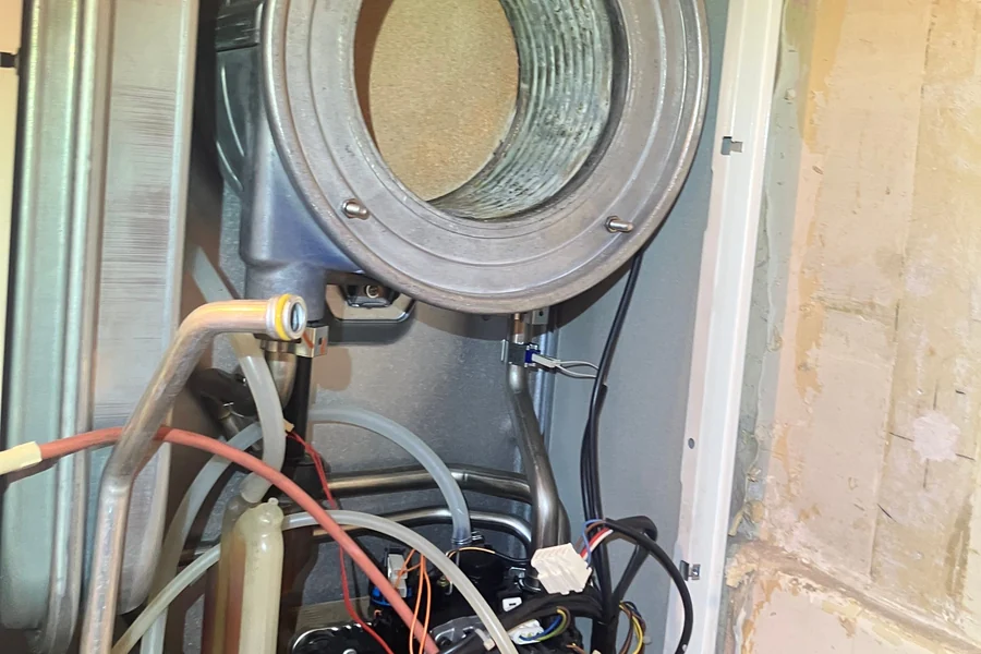 Boiler with the case removed during a service, showing the opened combustion chamber